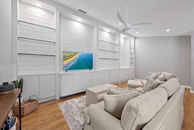 living room featuring recessed lighting, wood finished floors, visible vents, and ceiling fan