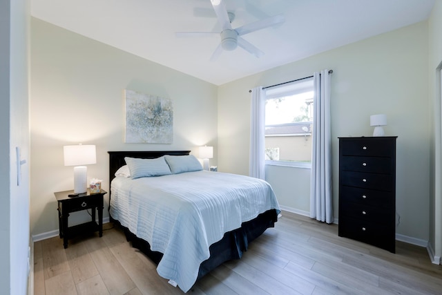 bedroom featuring ceiling fan and light hardwood / wood-style flooring