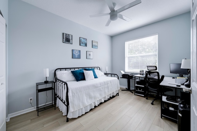 bedroom featuring ceiling fan and light wood-type flooring