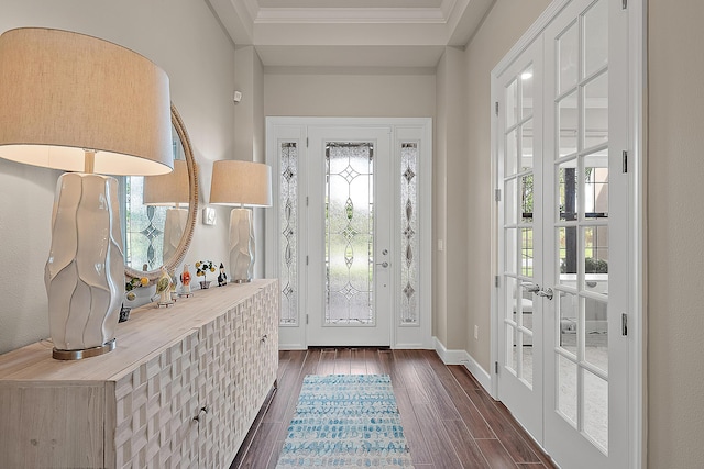 entryway with a wealth of natural light, crown molding, french doors, and dark hardwood / wood-style floors