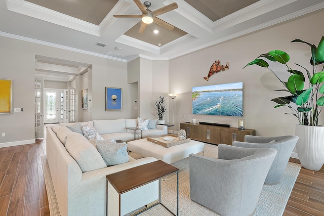 living room with crown molding, beamed ceiling, wood-type flooring, and coffered ceiling