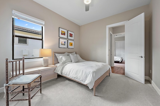 carpeted bedroom featuring ceiling fan