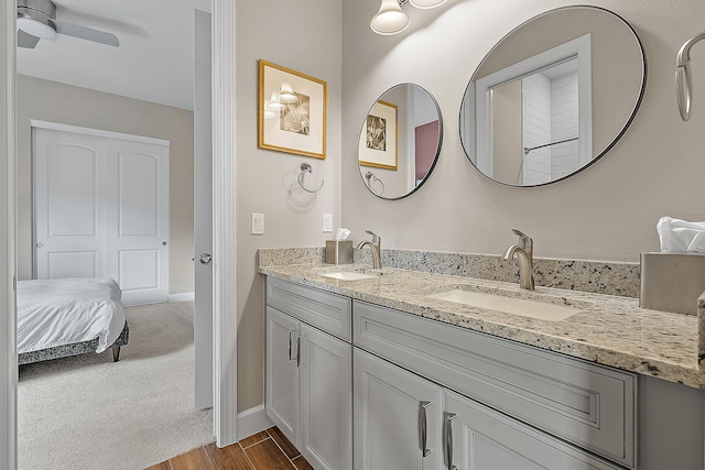 bathroom with ceiling fan and vanity