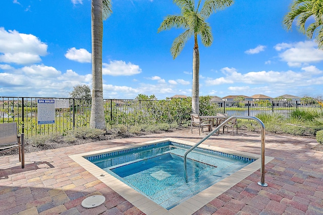 view of pool featuring a hot tub