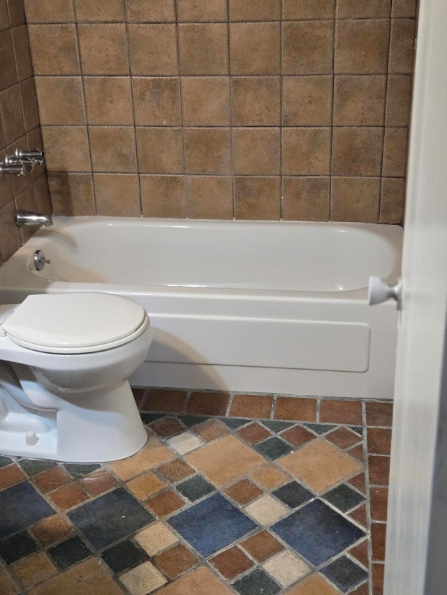 bathroom with toilet and shower / bathing tub combination