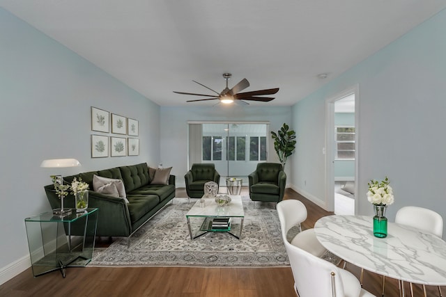 living room with hardwood / wood-style floors and ceiling fan