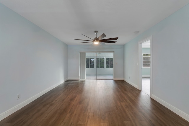 unfurnished room with ceiling fan and dark hardwood / wood-style flooring