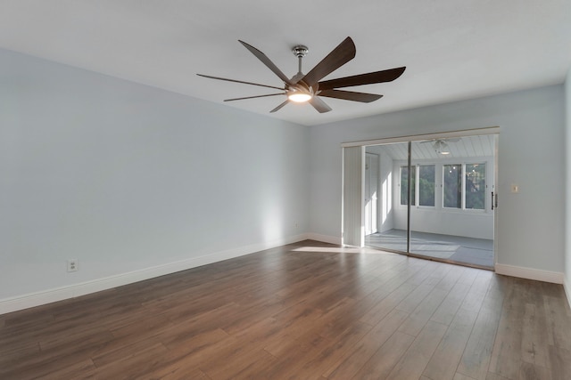 spare room featuring dark hardwood / wood-style floors and ceiling fan