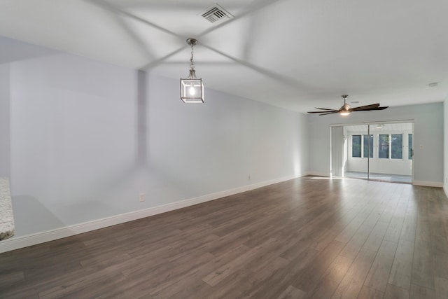 unfurnished living room featuring dark hardwood / wood-style floors and ceiling fan