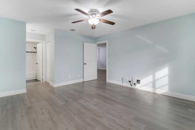 empty room with hardwood / wood-style floors and ceiling fan