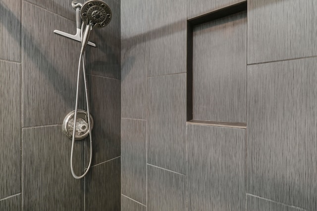 room details with a tile shower