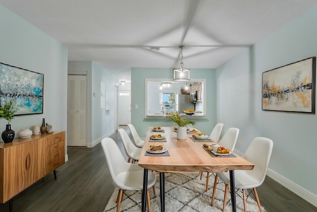 dining area with wood-type flooring