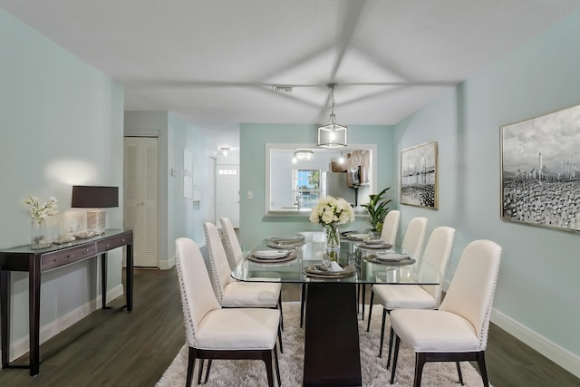 dining space featuring dark hardwood / wood-style floors