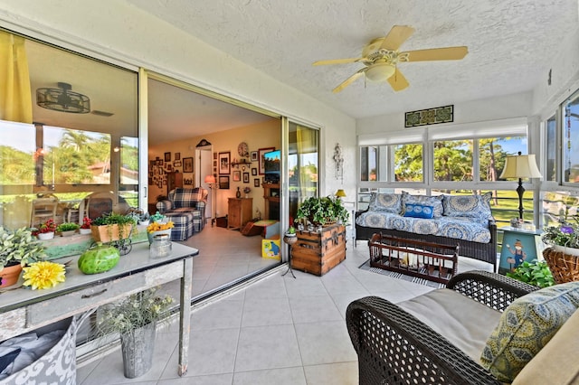 sunroom with ceiling fan