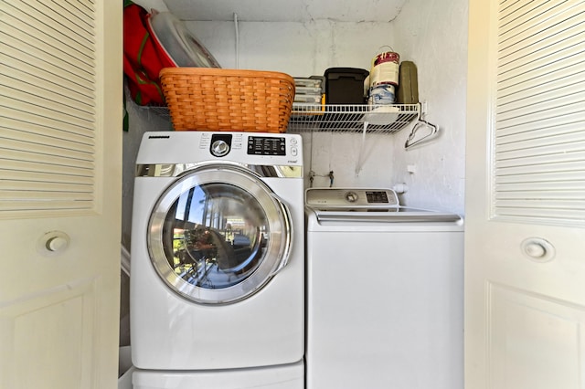 laundry area with washing machine and clothes dryer