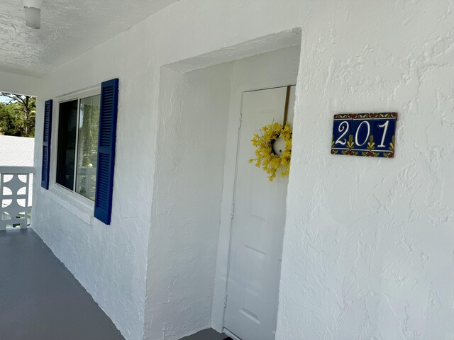 property entrance with covered porch