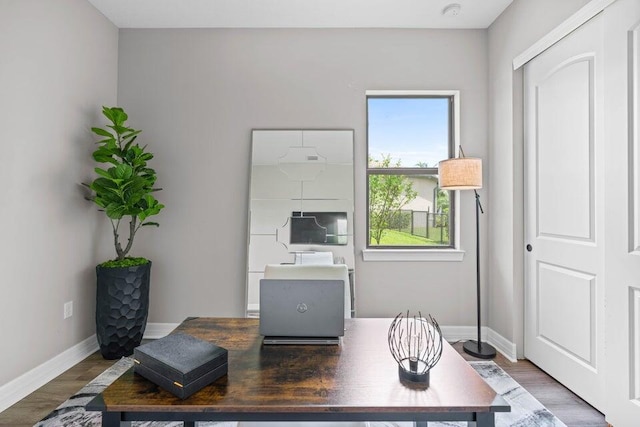 office space with dark wood-type flooring