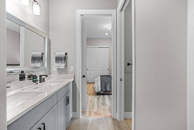 bathroom featuring vanity and hardwood / wood-style flooring