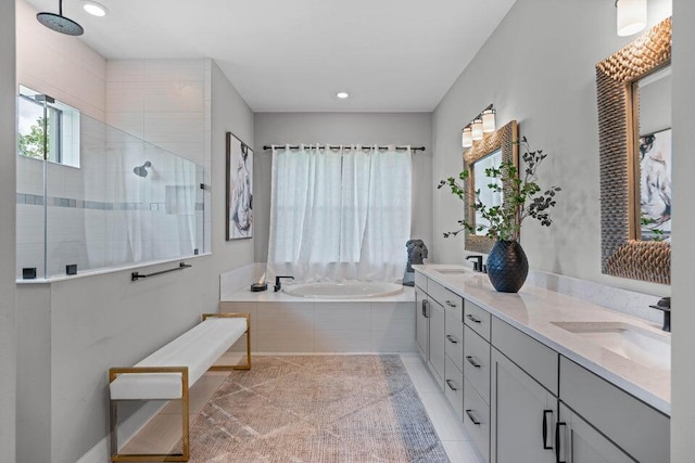 bathroom with vanity, shower with separate bathtub, and tile patterned flooring