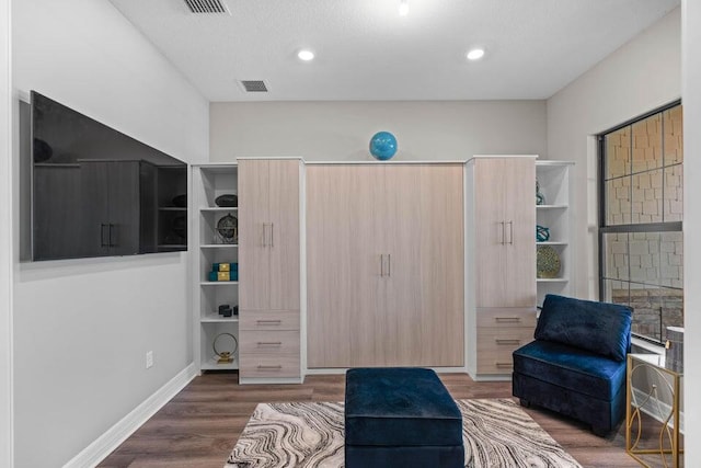 living area featuring dark hardwood / wood-style floors