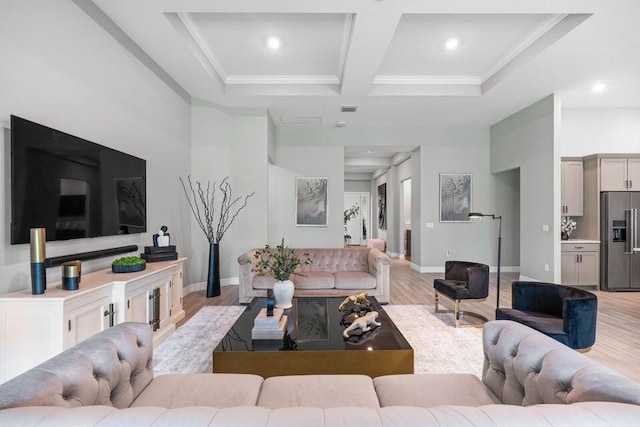 living room featuring ornamental molding, light hardwood / wood-style floors, beamed ceiling, and coffered ceiling