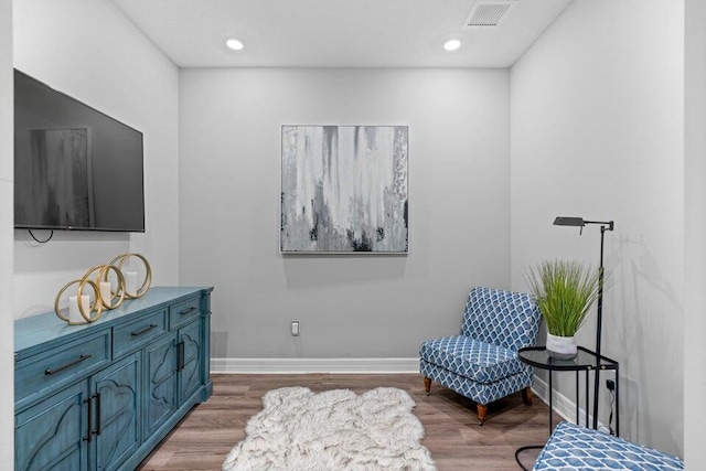 sitting room with light hardwood / wood-style floors