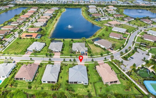 drone / aerial view with a water view