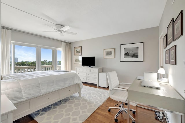 bedroom featuring hardwood / wood-style flooring and ceiling fan