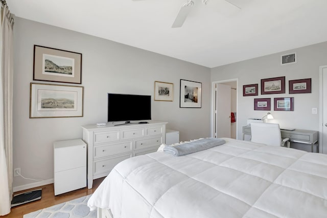 bedroom with ceiling fan and light hardwood / wood-style floors