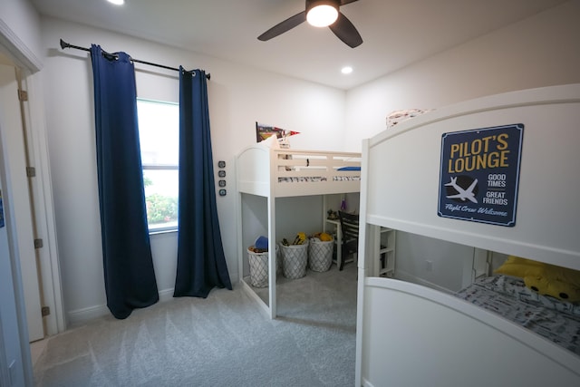 bedroom featuring ceiling fan and light colored carpet