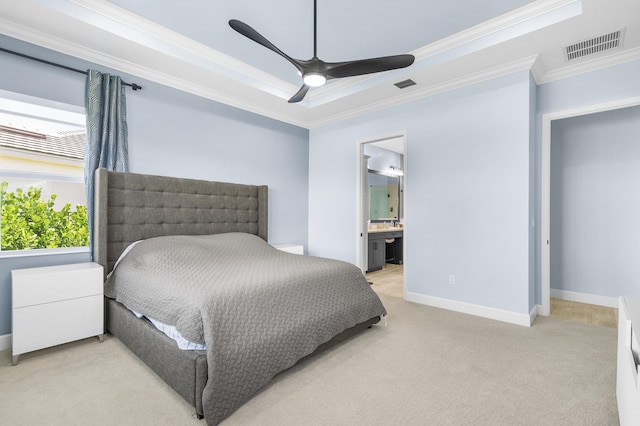 bedroom with ensuite bathroom, light colored carpet, ornamental molding, and ceiling fan