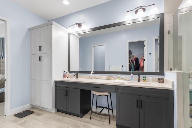 bathroom featuring hardwood / wood-style floors and vanity