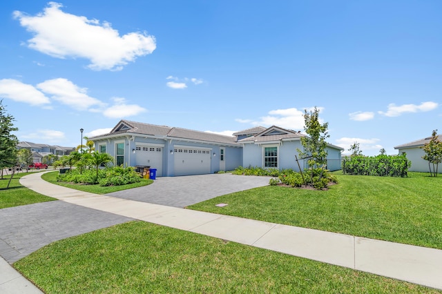 view of front facade with a garage and a front yard