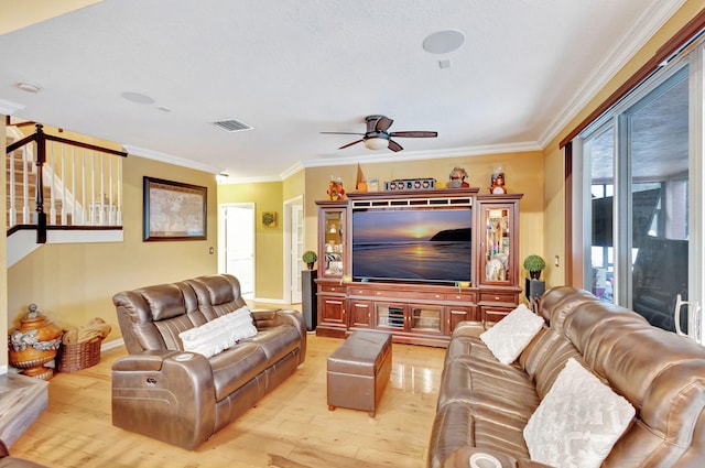 living room featuring light hardwood / wood-style flooring, ceiling fan, and ornamental molding