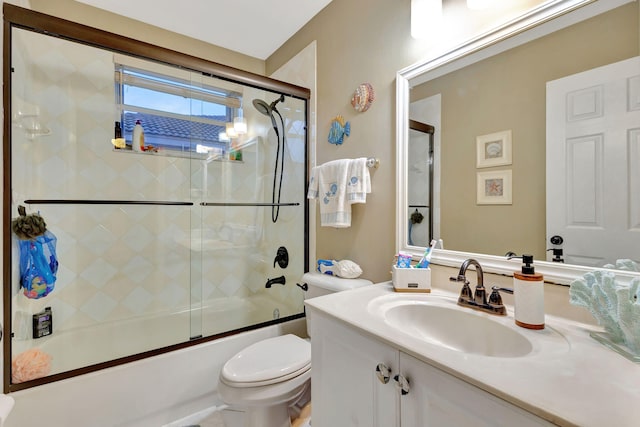 full bathroom featuring vanity, toilet, and enclosed tub / shower combo