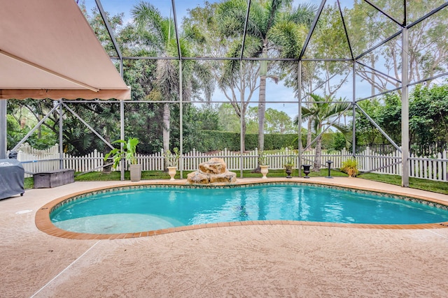 view of swimming pool featuring a patio area and grilling area