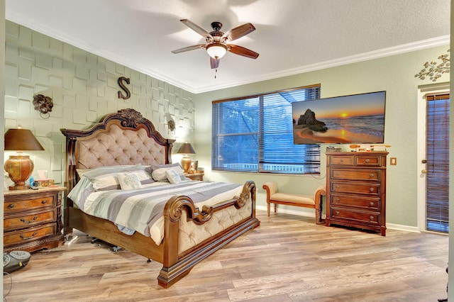 bedroom featuring ceiling fan, light hardwood / wood-style flooring, a textured ceiling, and ornamental molding