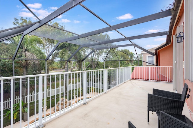 view of patio with glass enclosure