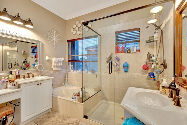 bathroom with vanity, crown molding, and independent shower and bath