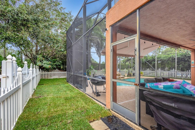 view of yard featuring a patio and glass enclosure