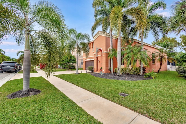 mediterranean / spanish home with a front yard