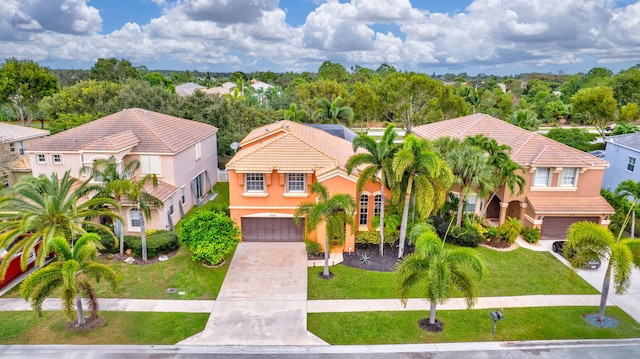 view of front of house with a front yard and a garage