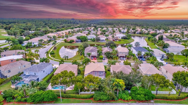 aerial view at dusk with a water view