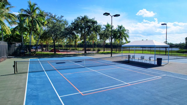 view of tennis court featuring basketball court