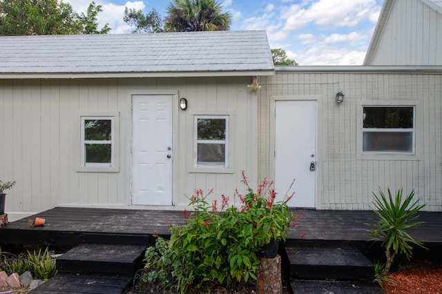 doorway to property with a wooden deck