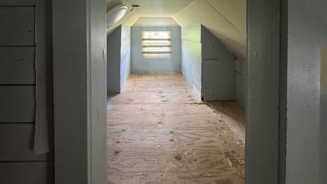 additional living space featuring lofted ceiling