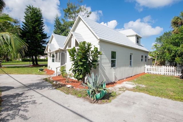 view of home's exterior featuring a lawn