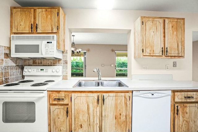 kitchen with tasteful backsplash, sink, white appliances, and light brown cabinets