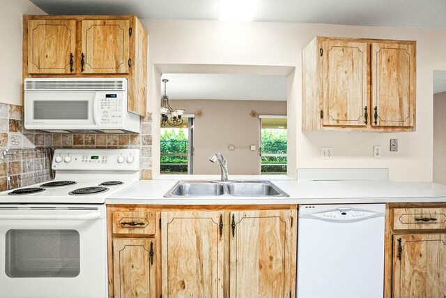 7410 Pine Forest Cir W, Lake Worth, FL 33467 - kitchen with a sink, light countertops, tasteful backsplash, and white appliances