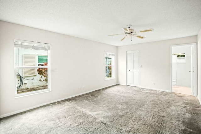 7410 Pine Forest Cir W, Lake Worth, FL 33467 - carpeted empty room featuring baseboards, ceiling fan, and a textured ceiling